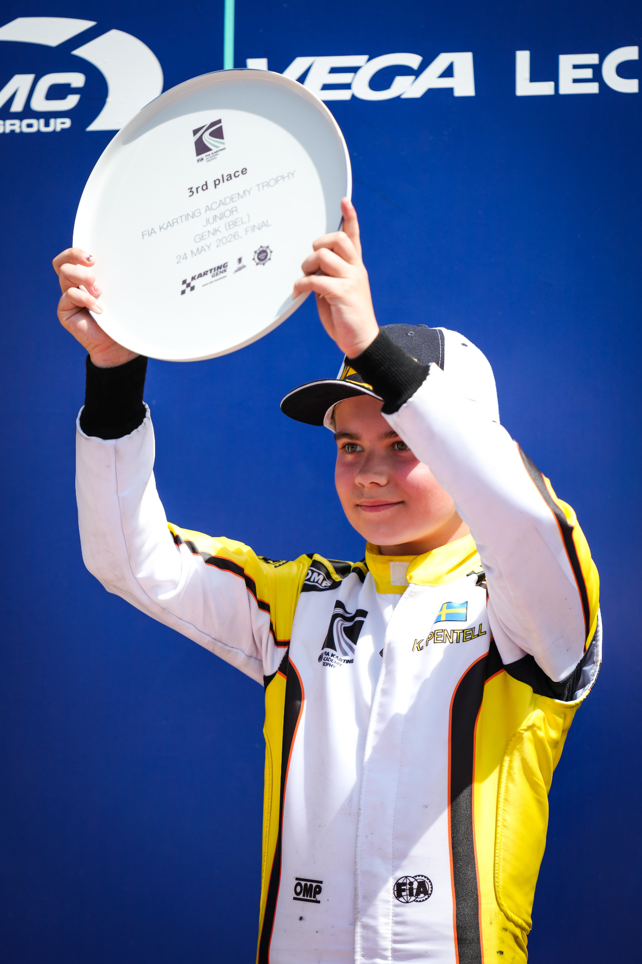 Kevin Pentell on the podium with trophy